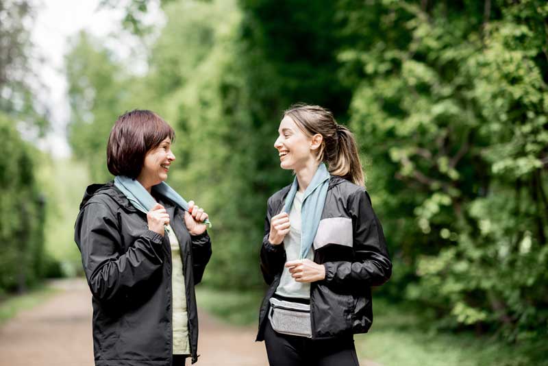 Two women talking outside